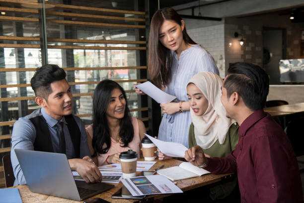 istock Young people conducting meeting in cafe and office 1078483072