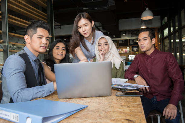 istock Young people conducting meeting in cafe and office 1078483172