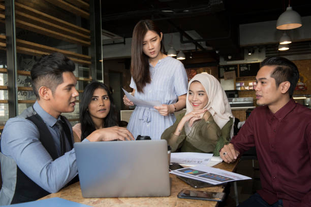 istock Young people conducting meeting in cafe and office 1078485018