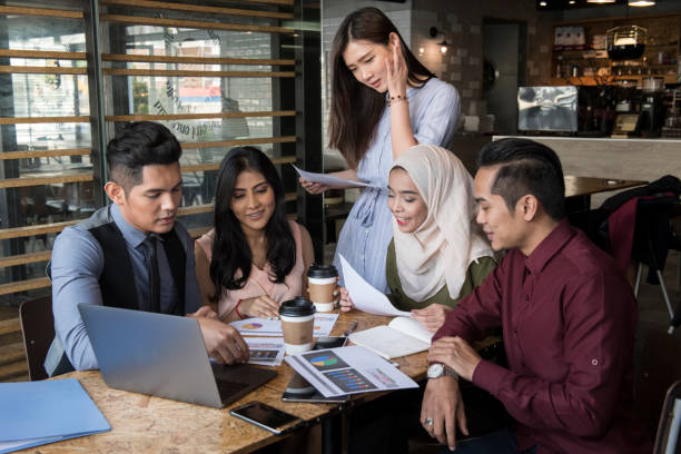 istock Young people conducting meeting in cafe and office 1078485072