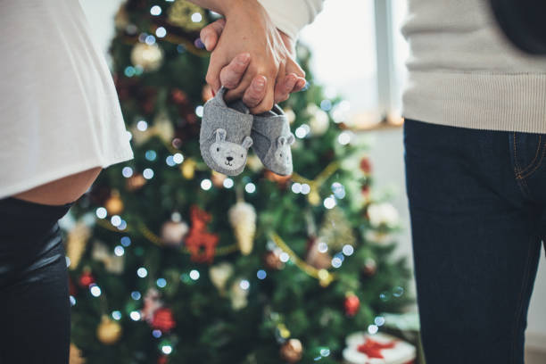 istock Couple holding baby shoes 1078492670