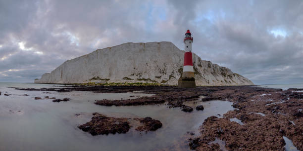 istock Looking up to Beachy Head light and cliff - a stitched panorama taken from below the light house at Beachy Head, East Sussex, UK 1078494708