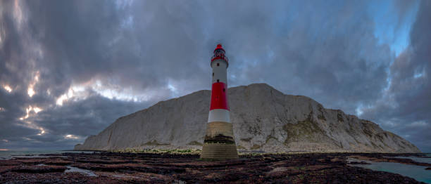 istock Looking up to Beachy Head light and cliff - a stitched panorama taken from below the light house at Beachy Head, East Sussex, UK 1078494852