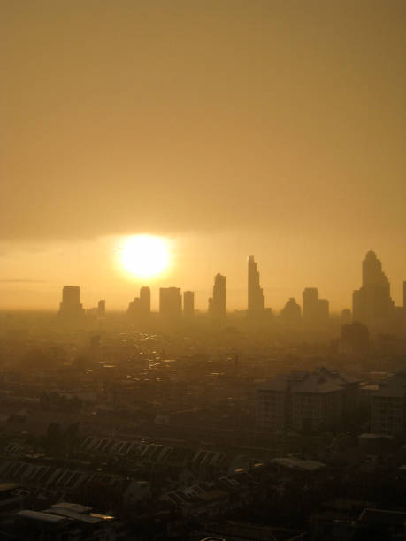 istock Silhouettes, skyscraper, downtown, Bangkok cityscapes, raining, sunset 1078499264