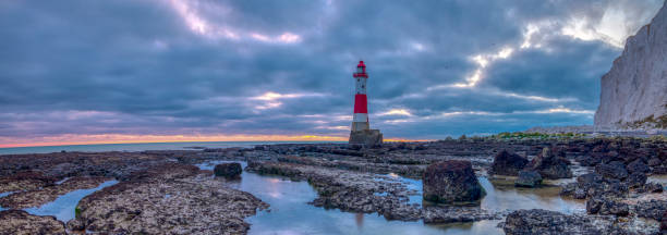 istock Looking up to Beachy Head light and cliff - a stitched panorama taken from below the light house at Beachy Head, East Sussex, UK 1078500118