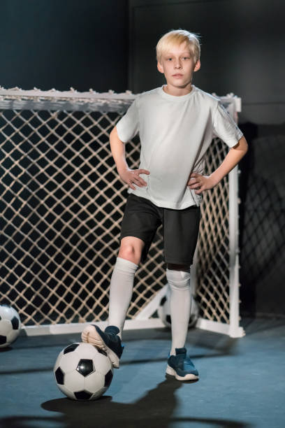 istock Cute Caucasian Boy Footballer 1078501582