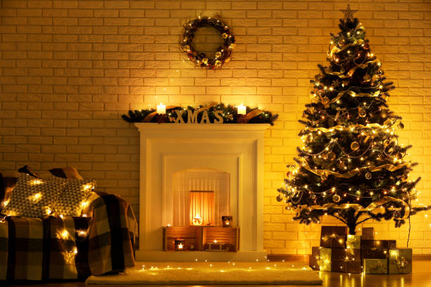 istock White decorated fireplace near christmas tree and sofa on brick wall background 1078504118