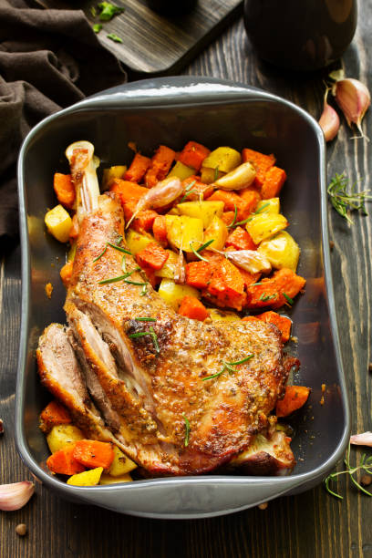 istock baked turkey thigh with vegetables. 1078505592