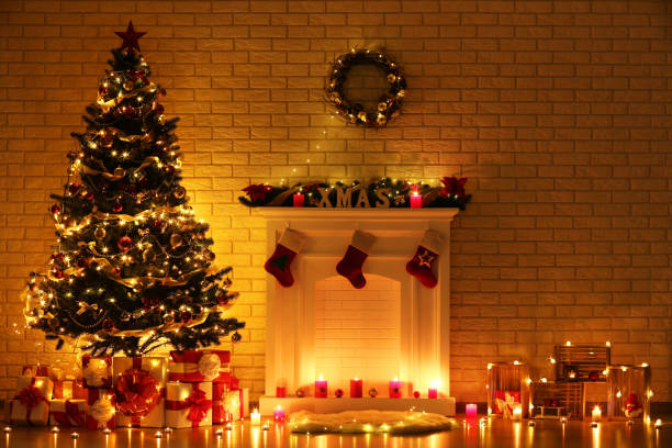 istock White decorated fireplace near christmas tree on brick wall background 1078507136