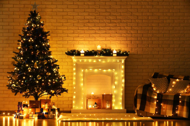 istock White decorated fireplace near christmas tree and sofa on brick wall background 1078507570