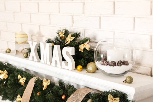 istock Christmas decorations with fireplace on brick wall background 1078507598