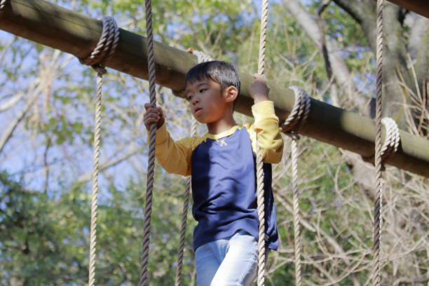 istock Japanese boy playing with ropewalking (third grade at elementary school) 1078507604