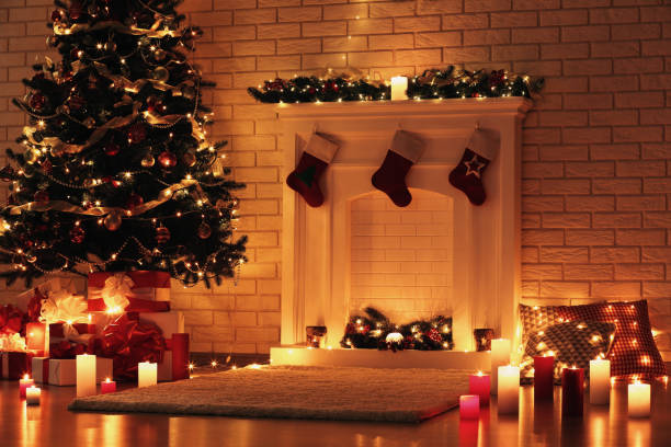 istock White decorated fireplace near christmas tree on brick wall background 1078507946