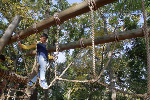 istock Japanese boy playing with ropewalking (third grade at elementary school) 1078508034