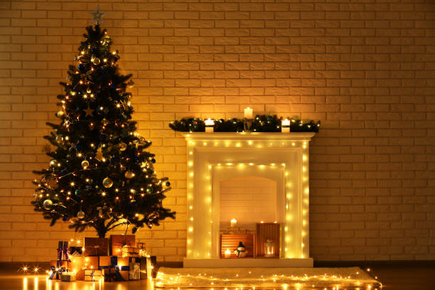 istock White decorated fireplace near christmas tree on brick wall background 1078508038