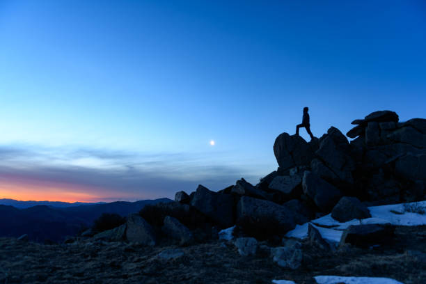 istock Successful men stand on the top of mountains 1078508304