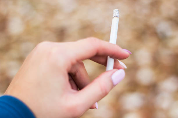 istock Young woman enjoying a cigarette 1078510502