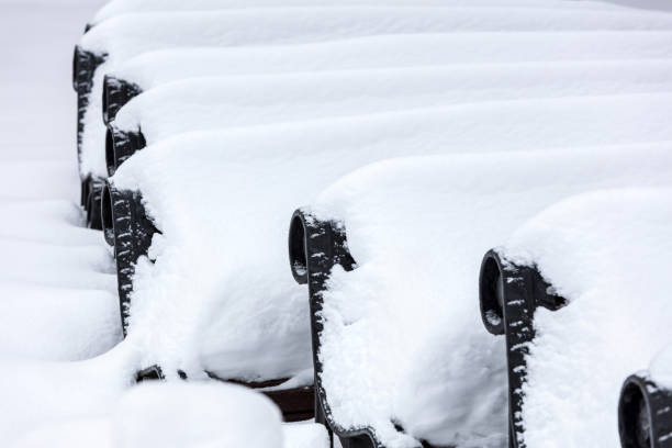 istock park benches covered by heavy white snow 1078516002