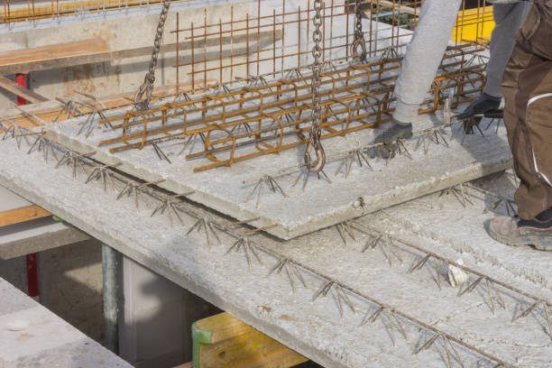 istock Worker relocates concrete slabs prefabricated parts 1078518442