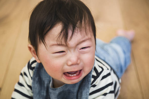 istock Baby crying in the living room 1078520972