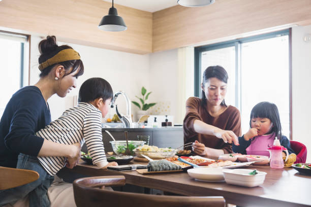 istock Mothers and kids enjoying lunch in the dining 1078520980