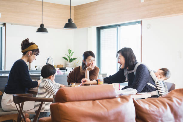 istock Mothers with kids talking on the table 1078521124