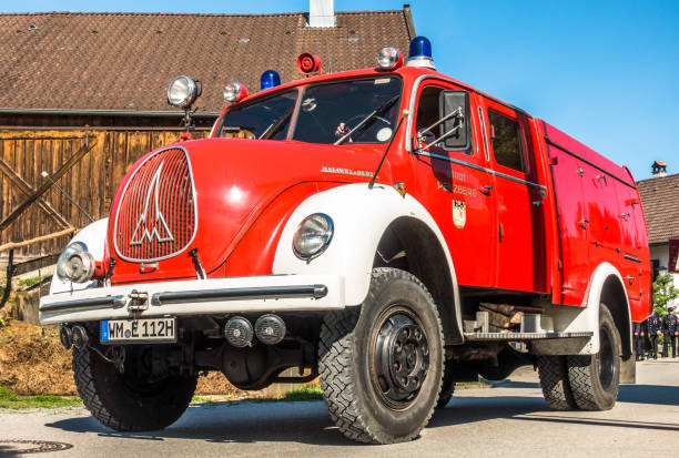 BICHL, GERMANY - MAY 13: a typical traditional bavarian parade for the 125th anniversary of the fire department in bichl, germany on may 13, 2018