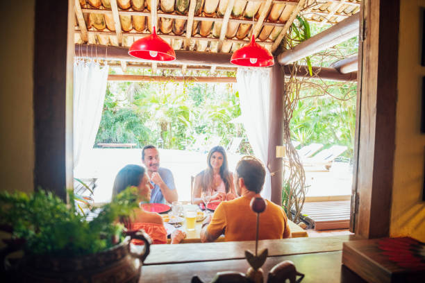istock Friends sitting on patio enjoying lunch 1078521936