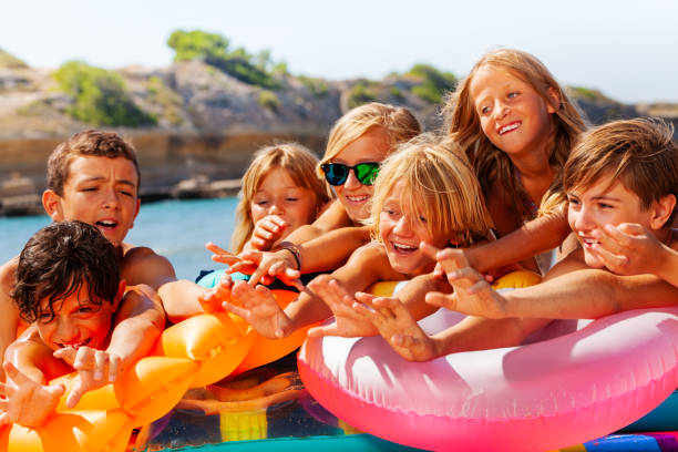 istock Kids playing with swimming tools on the beach 1078526564