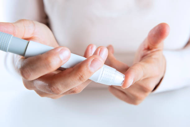 istock Woman taking her own blood sugar 1078527086