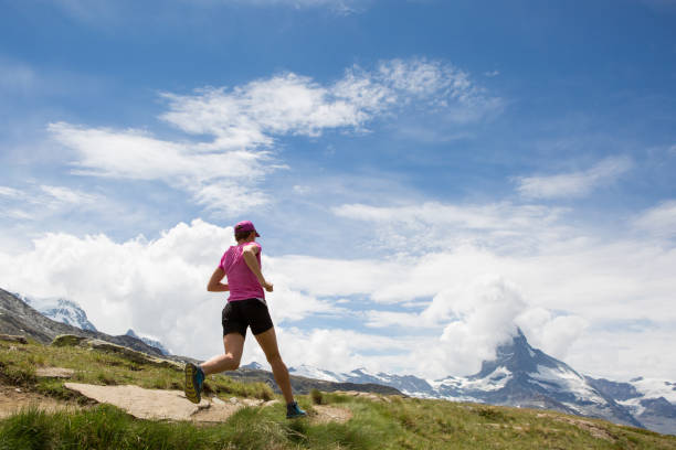 istock Woman running on a mountain trail 1078527598