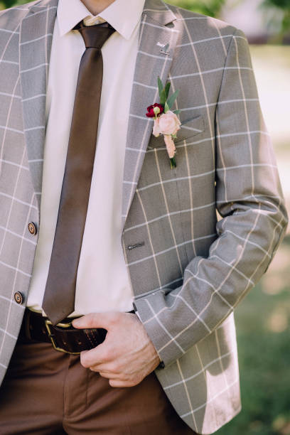 istock handsone groom brown trousers and grey checkered 1078537252