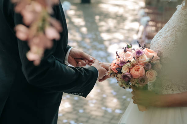 istock Wedding ceremony bride groom putting golden rings 1078537298