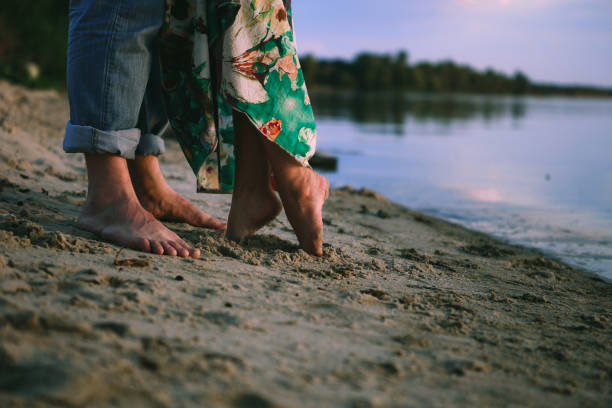 istock couple play shore love clothes 1078537328