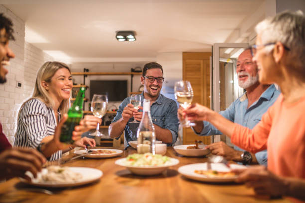istock Cheerful people having a celebratory toast during dinner 1078541064