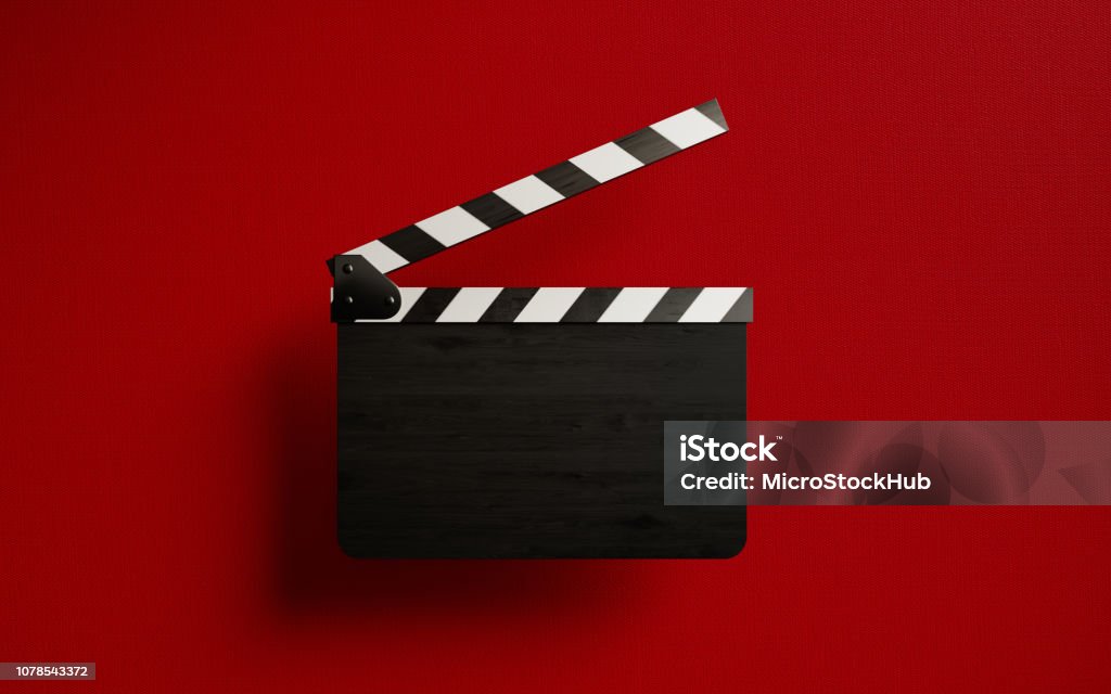 Blank Film Slate On Red Background Blank film slate isolated on red background. Horizontal composition with copy space. Movie Theater Stock Photo