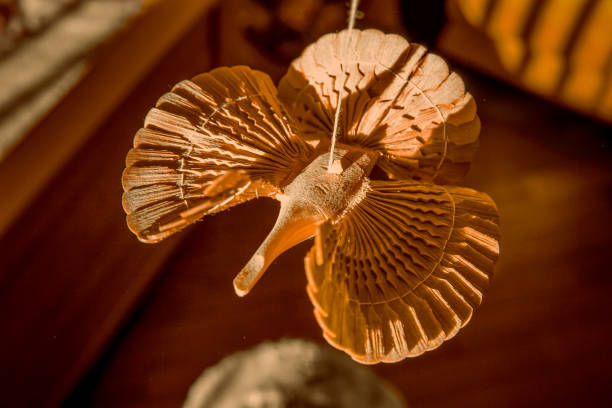 Wooden Bird of happiness - russian ancient traditional toy - a charm Wooden Bird of happiness - russian ancient traditional toy of wooden chips traditional sun symbol art for sale stock pictures, royalty-free photos & images