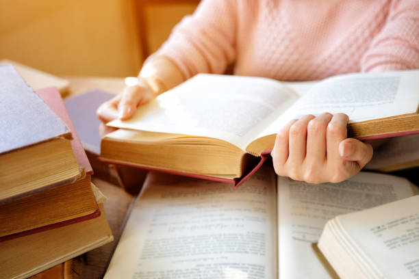 istock Young woman studying in a library 1078544426