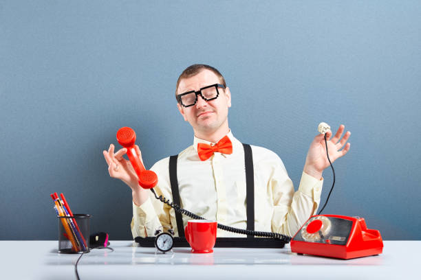 istock Relaxed nerd guy holding unplugged phone 1078544466