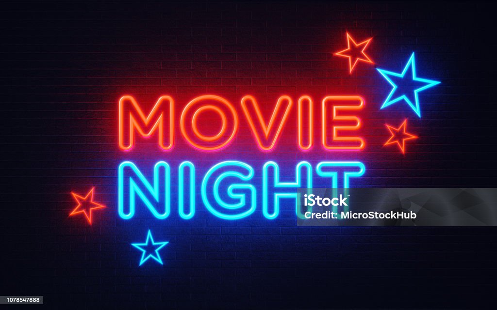Movie Night Neon Light On Black Wall - Movie Night Concept Movie night neon light on black wall. Horizontal composition with copy space. Movie night and entertainment concept. Movie Stock Photo