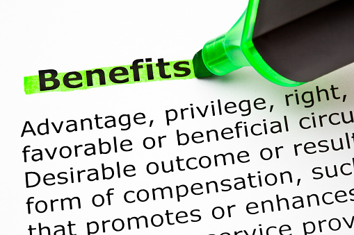 Dictionary definition of the word Benefits highlighted with green text marker.
