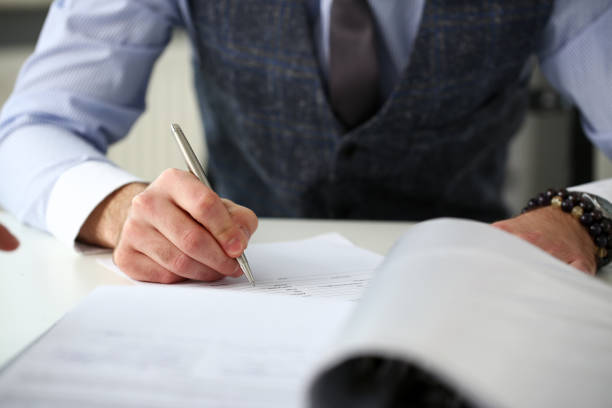 istock Clerk man at office workplace with silver pen in arms 1078548616