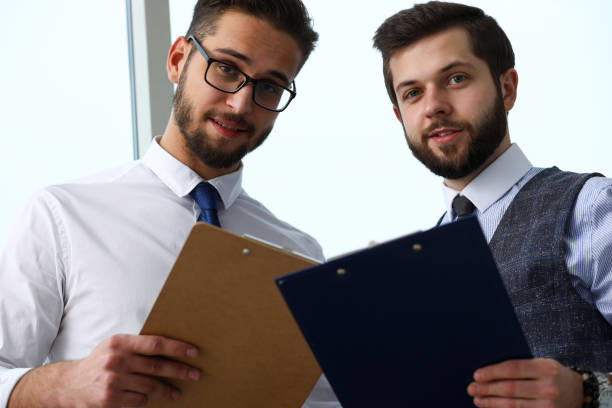 istock Group of modern businesspeople in office debate on financial issue 1078548824