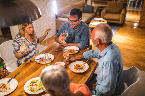 istock Modern family dining together at home 1078551810