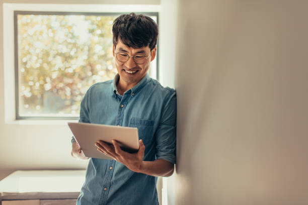 istock Man at home updating his social media status 1078552042