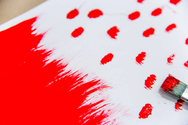 istock several paintbrushes with a painting on a table 1078554404