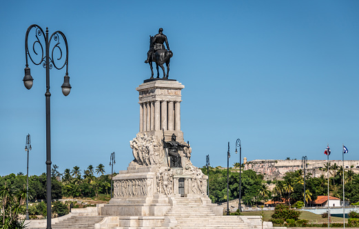 Havana, Cuba. 20th November 2018. A large monument to Maximo Gomez in Havana, Cuba, with street lamps and the wider city.