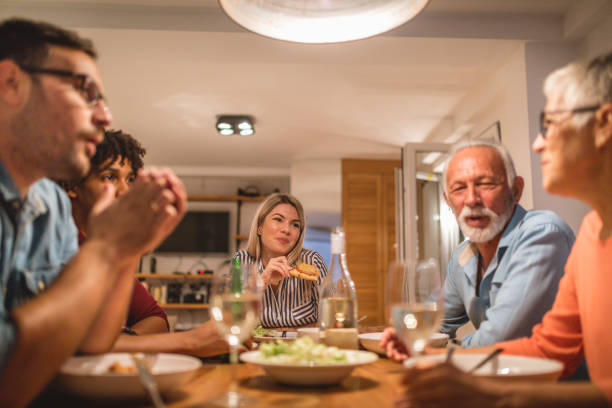 istock Lovely diverse family enjoying dinner together at home 1078555120