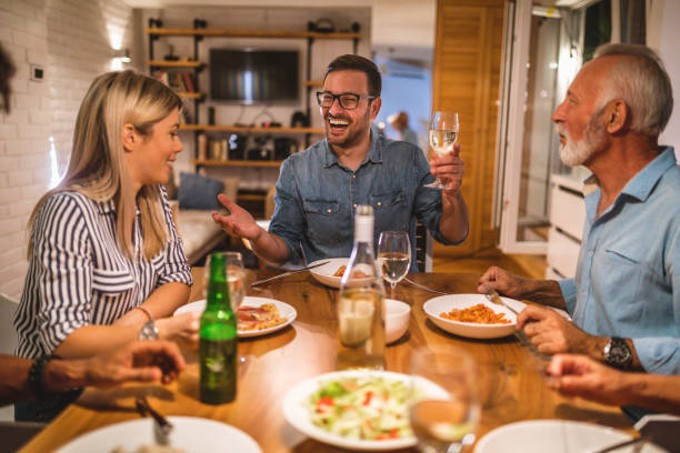 istock Group of people enjoying dinner 1078557616