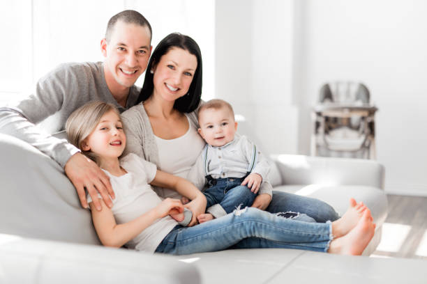 istock young family at home having fun on sofa 1078558222